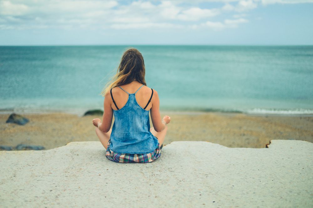 Woman sitting in meditation. Things that matter less after 50...believing there was a right body.